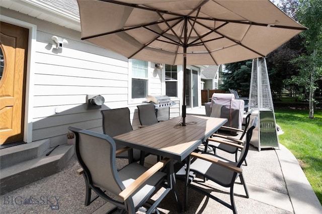911 N Aster, Bozeman, MT 59718 - view of patio / terrace with a grill, entry steps, and outdoor dining area