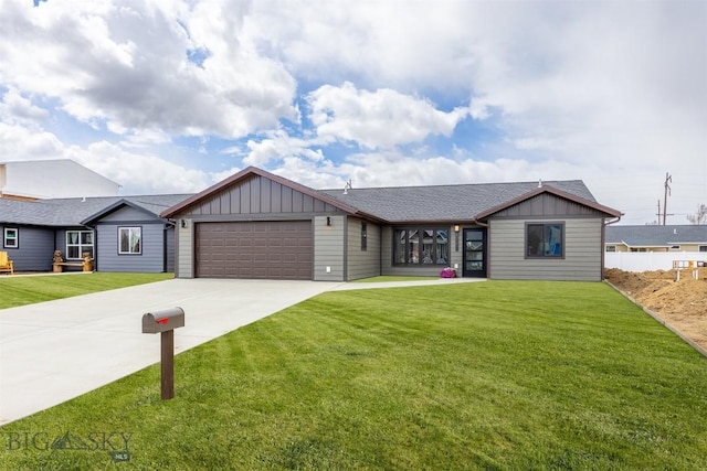 2305 S Colorado, Butte, MT 59701 - view of front of property with board and batten siding, driveway, a garage, and a front yard