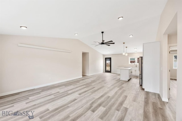 2305 S Colorado, Butte, MT 59701 - unfurnished living room with lofted ceiling, a ceiling fan, healthy amount of natural light, light wood-style floors, and recessed lighting