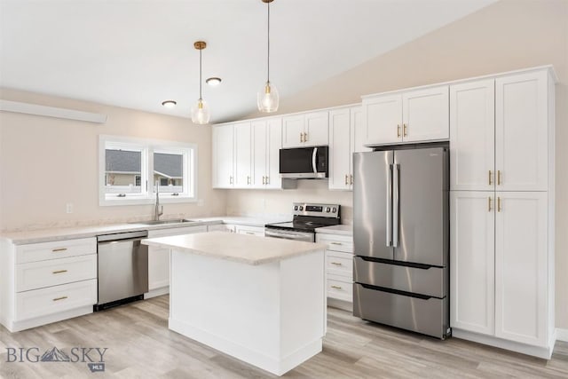2305 S Colorado, Butte, MT 59701 - kitchen with appliances with stainless steel finishes, white cabinets, light wood-style flooring, and vaulted ceiling