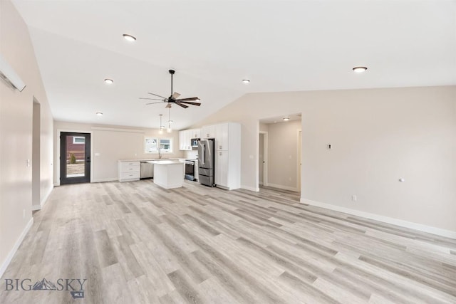 2305 S Colorado, Butte, MT 59701 - unfurnished living room featuring vaulted ceiling, a ceiling fan, light wood-style flooring, and recessed lighting