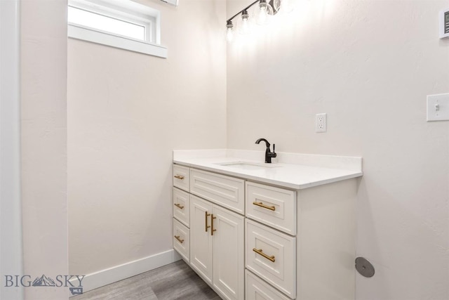 2305 S Colorado, Butte, MT 59701 - bathroom featuring wood finished floors and vanity