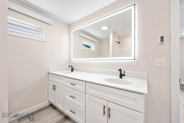 2305 S Colorado, Butte, MT 59701 - full bathroom with double vanity and wood finished floors