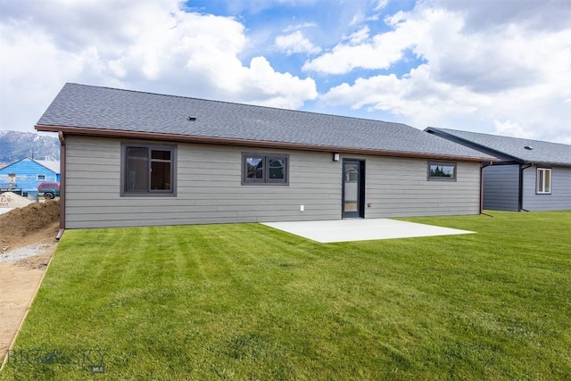 2305 S Colorado, Butte, MT 59701 - back of property with a patio area, a lawn, and roof with shingles