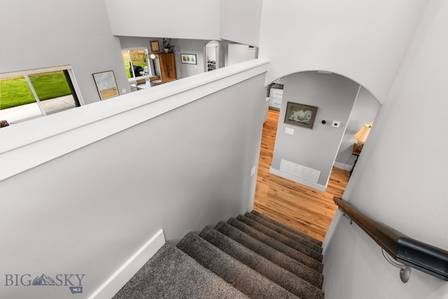 85 Riparian Way, Bozeman, MT 59718 - staircase featuring wood finished floors and arched walkways