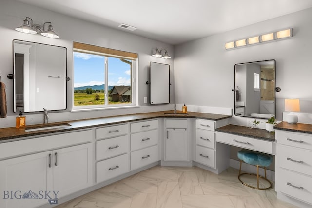 85 Riparian Way, Bozeman, MT 59718 - full bath featuring double vanity, marble finish flooring, and a shower