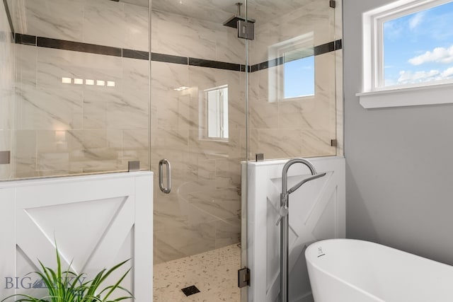 85 Riparian Way, Bozeman, MT 59718 - full bath featuring a freestanding tub and a marble finish shower