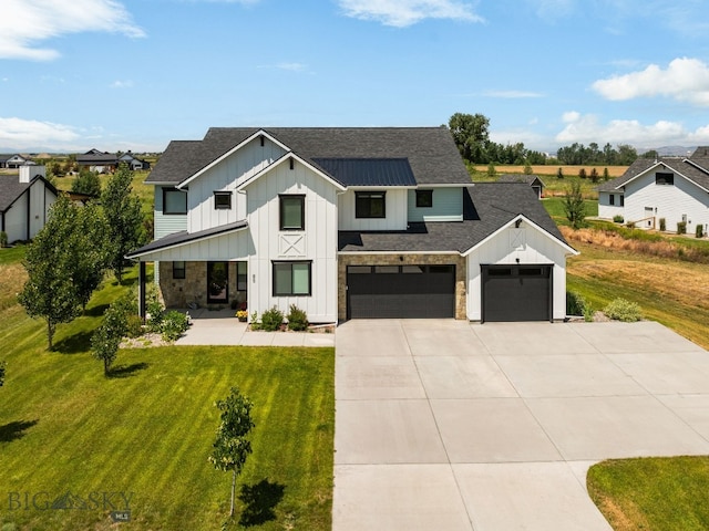 85 Riparian Way, Bozeman, MT 59718 - modern farmhouse with board and batten siding, concrete driveway, a front lawn, a shingled roof, and an attached garage