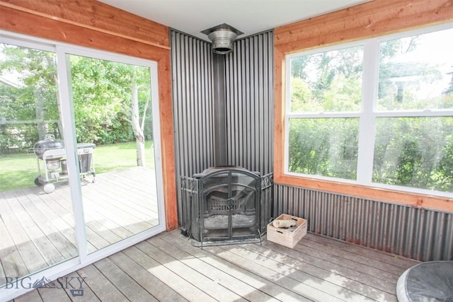 717 N Aster Ave, Bozeman, MT 59718 - sunroom / solarium featuring plenty of natural light and a wood stove