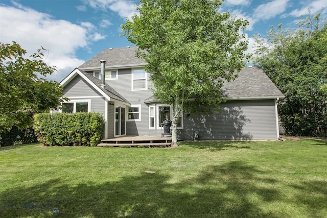 717 N Aster Ave, Bozeman, MT 59718 - rear view of property featuring a deck, a yard, and roof with shingles