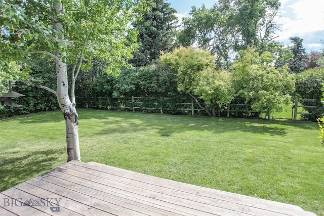 717 N Aster Ave, Bozeman, MT 59718 - view of yard with a wooden deck and view of scattered trees