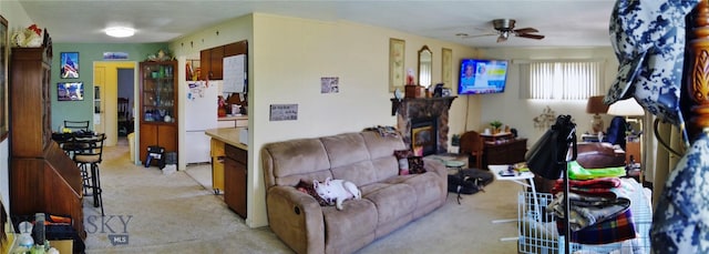 2320 S S Dr, Butte, MT 59701 - living area featuring light colored carpet, a ceiling fan, and a glass covered fireplace