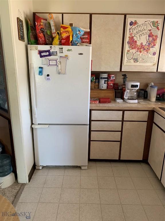 2320 S S Dr, Butte, MT 59701 - kitchen with freestanding refrigerator and light countertops