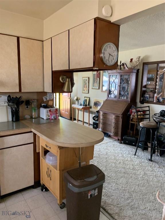 2320 S S Dr, Butte, MT 59701 - kitchen with a textured ceiling and light tile patterned floors