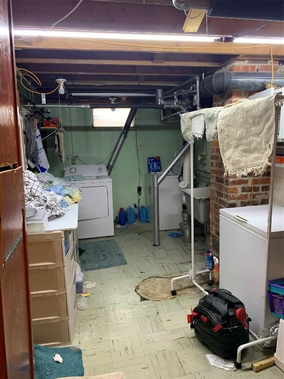 2320 S S Dr, Butte, MT 59701 - unfinished basement with washer / clothes dryer, tile patterned floors, and refrigerator