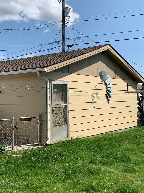 2320 S S Dr, Butte, MT 59701 - view of side of property with a shingled roof and a gate