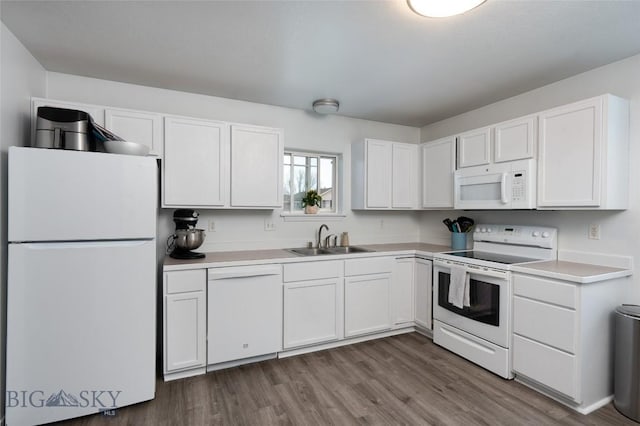208 Show Pl Unit A, Belgrade, MT 59714 - kitchen featuring white appliances, white cabinetry, dark wood finished floors, and light countertops