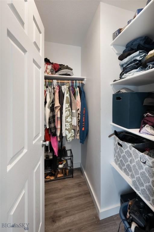 208 Show Pl Unit A, Belgrade, MT 59714 - walk in closet with wood finished floors