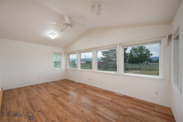1680 Remuda Dr, Belgrade, MT 59714 - spare room featuring ceiling fan, wood finished floors, and lofted ceiling