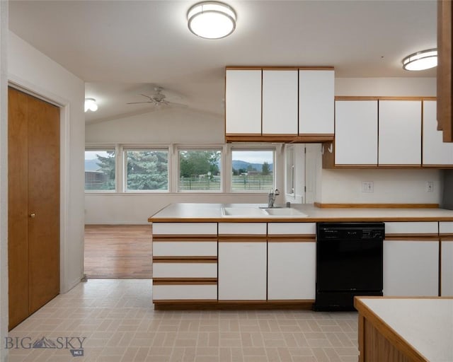 1680 Remuda Dr, Belgrade, MT 59714 - kitchen featuring black dishwasher, white cabinets, light countertops, ceiling fan, and vaulted ceiling