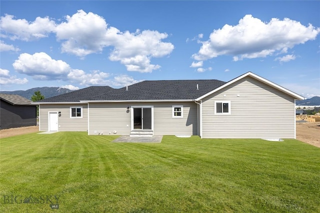 3815 S Arizona, Butte, MT 59701 - rear view of property featuring a lawn, a mountain view, and roof with shingles