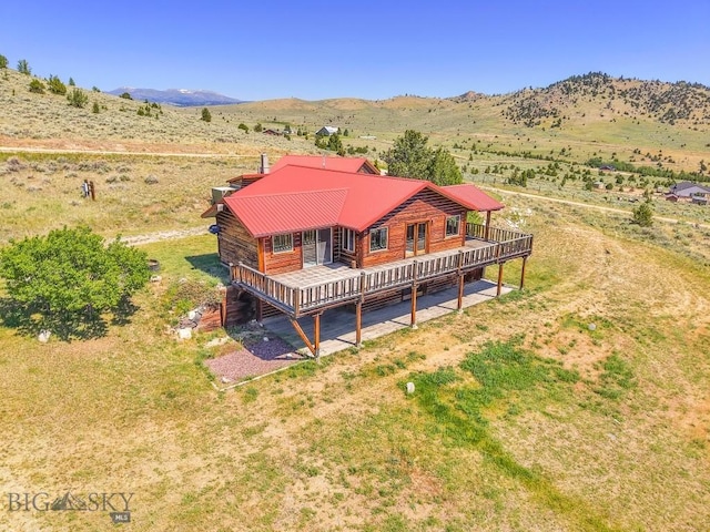 2 Eight Mile Creek Rd, Ennis, MT 59729 - back of house featuring a deck with mountain view and a view of rural / pastoral area