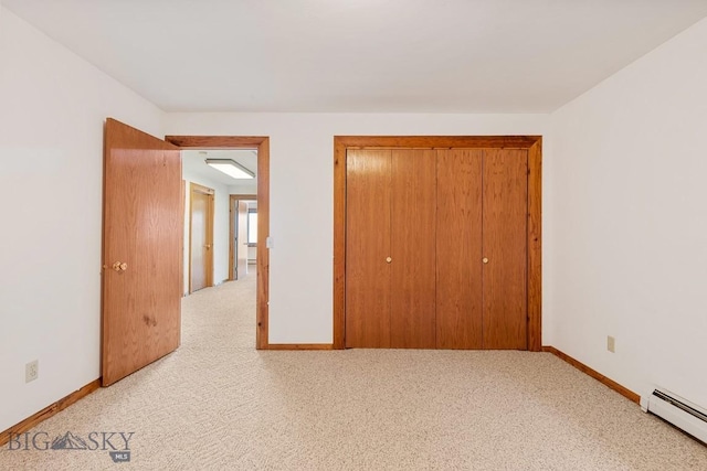 2 Eight Mile Creek Rd, Ennis, MT 59729 - unfurnished bedroom featuring baseboard heating, a closet, and carpet