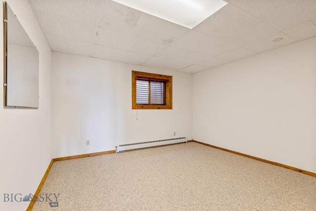 2 Eight Mile Creek Rd, Ennis, MT 59729 - empty room featuring baseboard heating, carpet floors, and a drop ceiling
