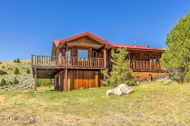 2 Eight Mile Creek Rd, Ennis, MT 59729 - back of property featuring a metal roof and a deck