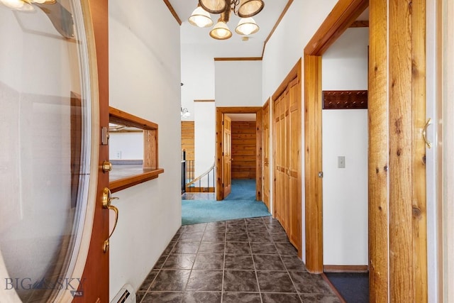 2 Eight Mile Creek Rd, Ennis, MT 59729 - corridor with a chandelier, dark colored carpet, and baseboard heating