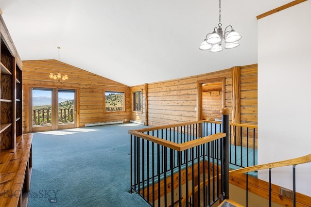 2 Eight Mile Creek Rd, Ennis, MT 59729 - stairs with a chandelier, wood walls, lofted ceiling, baseboard heating, and carpet flooring