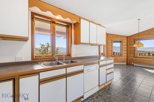 2 Eight Mile Creek Rd, Ennis, MT 59729 - kitchen featuring dishwasher, vaulted ceiling, wooden walls, white cabinetry, and decorative light fixtures