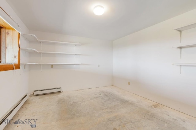 2 Eight Mile Creek Rd, Ennis, MT 59729 - empty room featuring a baseboard heating unit and concrete flooring