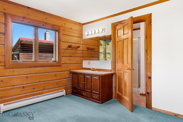2 Eight Mile Creek Rd, Ennis, MT 59729 - bathroom featuring baseboard heating, vanity, wooden walls, and carpet