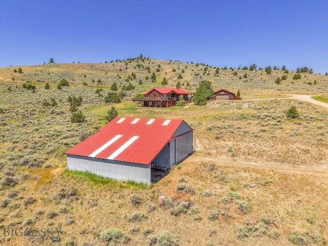 2 Eight Mile Creek Rd, Ennis, MT 59729 - view of yard featuring a pole building, an outbuilding, and a rural view