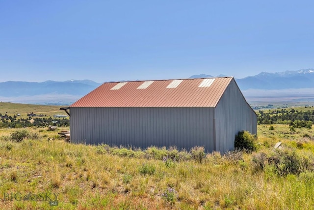 2 Eight Mile Creek Rd, Ennis, MT 59729 - view of side of home with an outbuilding and a mountain view