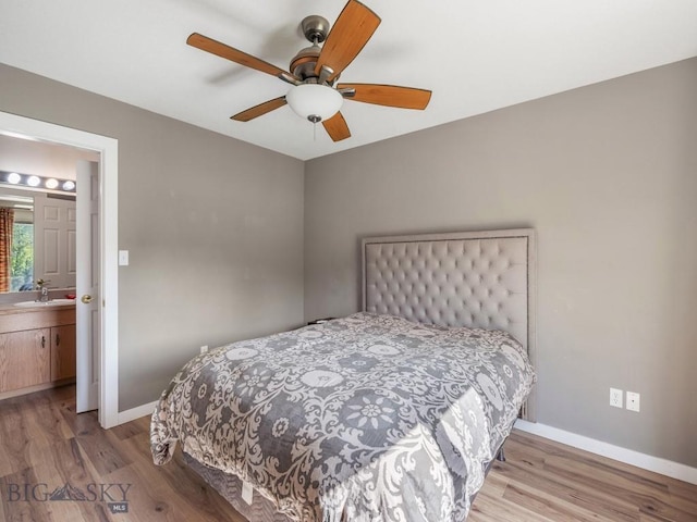 417 Firelight, Big Sky, MT 59716 - bedroom featuring wood finished floors and a ceiling fan