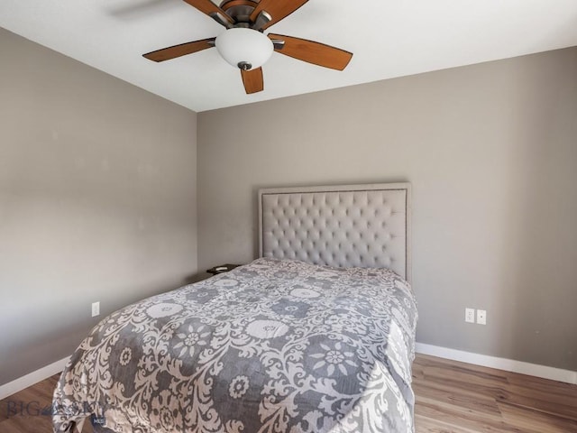 417 Firelight, Big Sky, MT 59716 - bedroom featuring wood finished floors and ceiling fan
