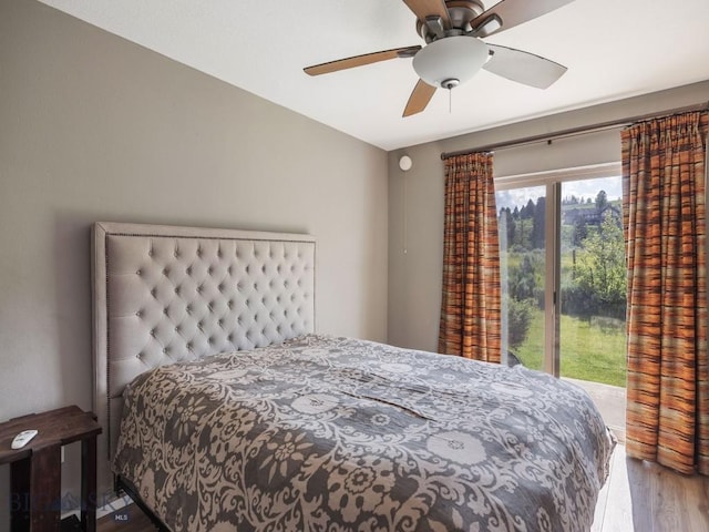 417 Firelight, Big Sky, MT 59716 - bedroom with access to outside, wood finished floors, and a ceiling fan