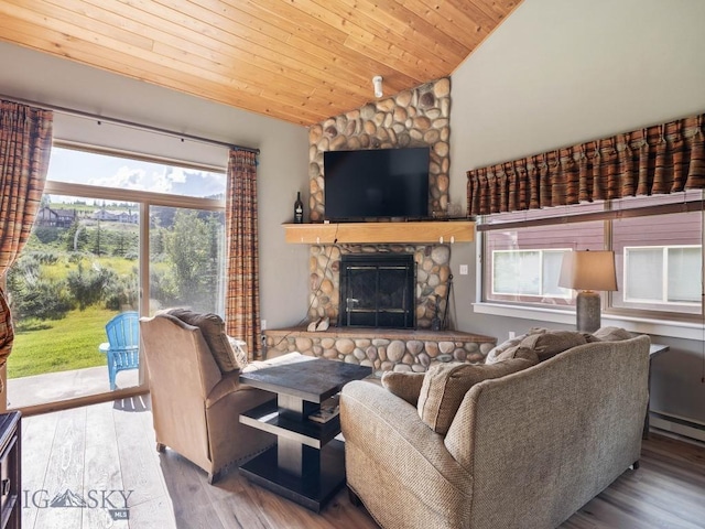 417 Firelight, Big Sky, MT 59716 - living room with lofted ceiling, wood finished floors, a fireplace, wooden ceiling, and a baseboard radiator