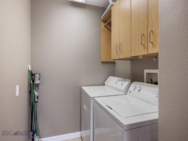 417 Firelight, Big Sky, MT 59716 - washroom featuring washing machine and clothes dryer and cabinet space