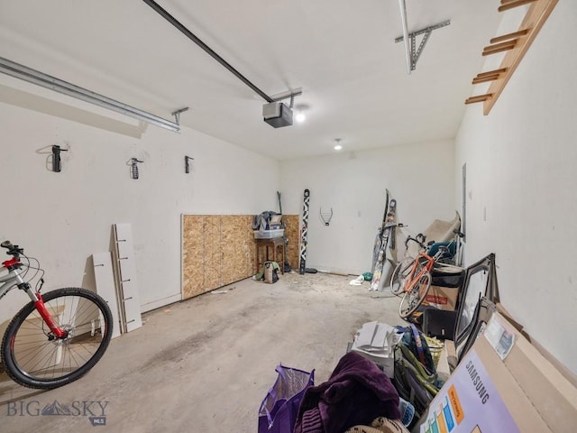 417 Firelight, Big Sky, MT 59716 - garage featuring a garage door opener