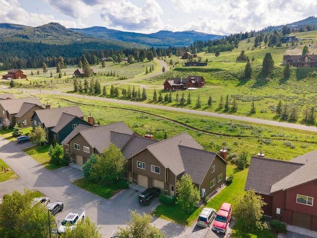 417 Firelight, Big Sky, MT 59716 - aerial view of sparsely populated area with a mountain backdrop and nearby suburban area