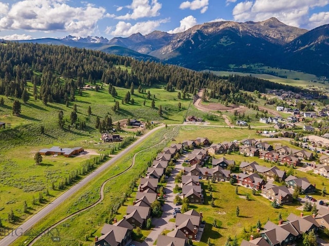 417 Firelight, Big Sky, MT 59716 - aerial view of property and surrounding area featuring a mountain backdrop and nearby suburban area