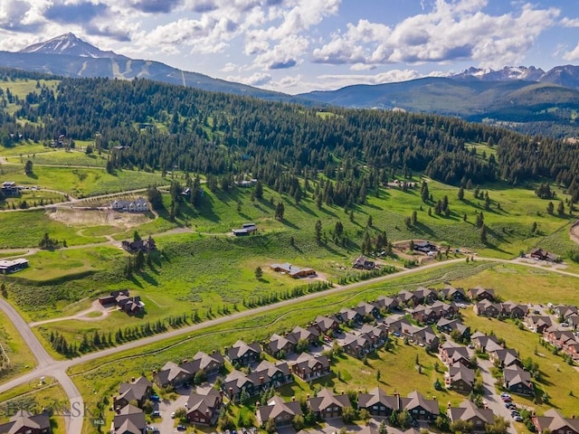 417 Firelight, Big Sky, MT 59716 - aerial view of property and surrounding area with a mountainous background and nearby suburban area