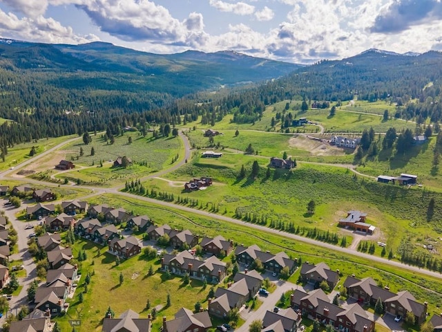 417 Firelight, Big Sky, MT 59716 - view of property location featuring a mountain backdrop and a forest