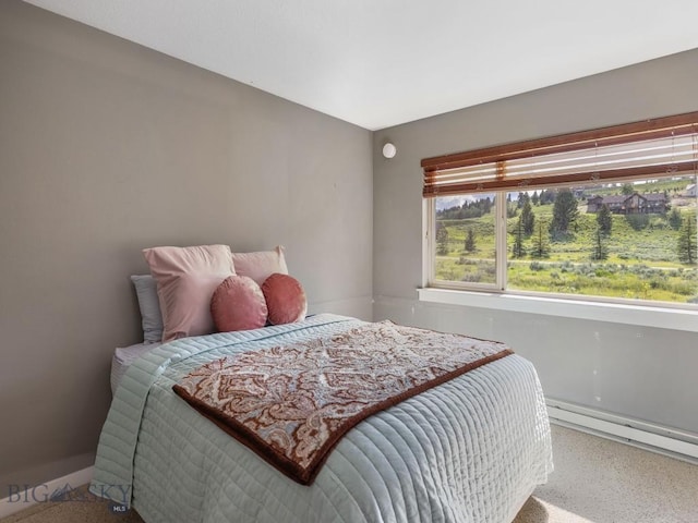 417 Firelight, Big Sky, MT 59716 - bedroom with a baseboard radiator and carpet flooring