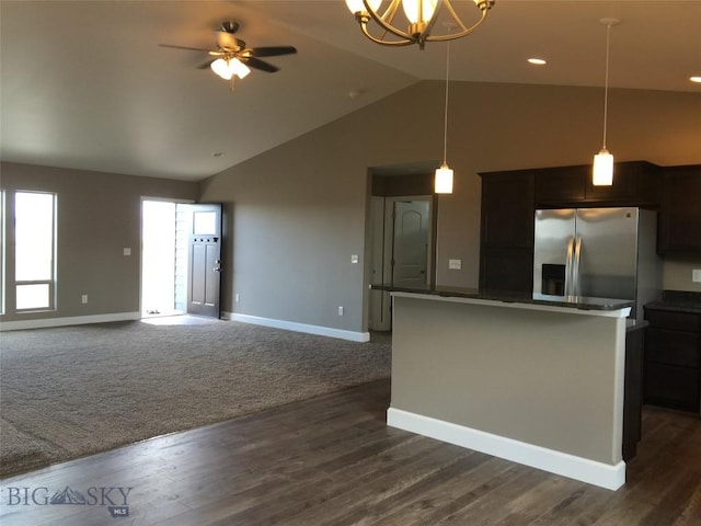 639 Avon Cir, Butte, MT 59701 - kitchen with stainless steel fridge, dark countertops, a kitchen island, pendant lighting, and high vaulted ceiling