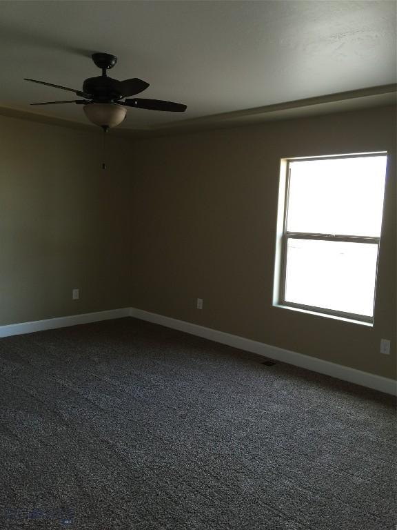 639 Avon Cir, Butte, MT 59701 - carpeted spare room featuring ceiling fan and baseboards