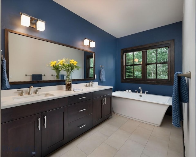 89 W Fieldview St, Bozeman, MT 59715 - bathroom featuring double vanity, a soaking tub, and tile patterned flooring